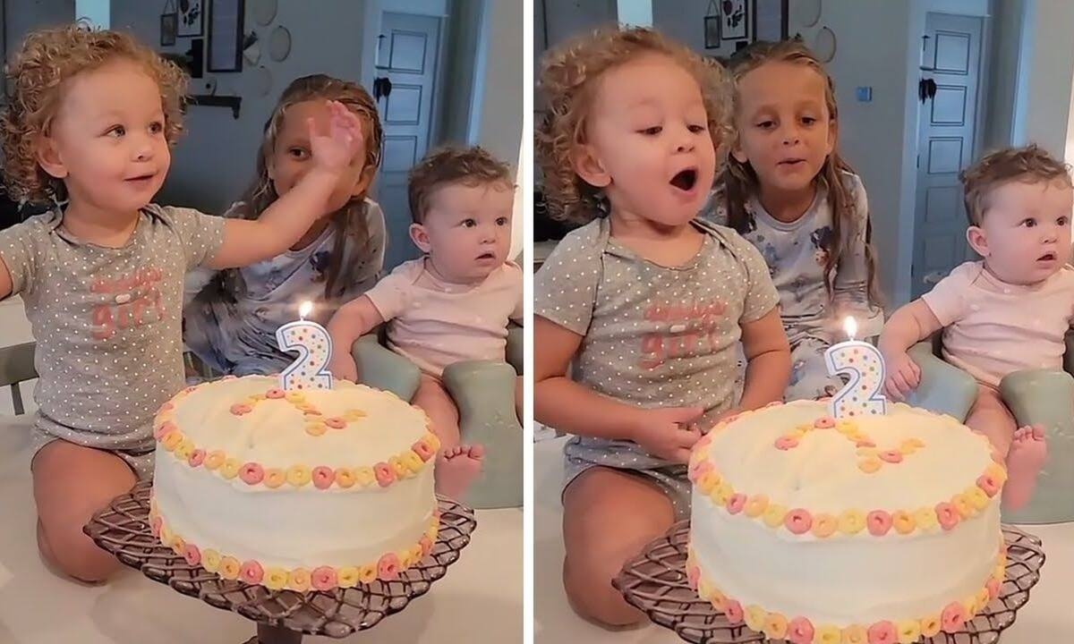 Κοριτσάκι προσπαθεί να σβήσει το κεράκι της τούρτας αλλά ο μπαμπάς του δεν το αφήνει