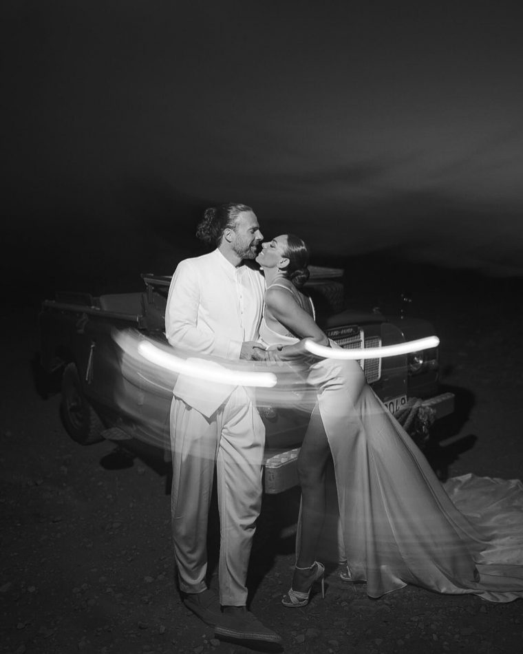 Photo-shared-by-Evridiki-Valavani-on-September-02-2024-tagging-@morgan.grigoris.-May-be-a-black-and-white-image-of-3-people-people-kissing-sparkler-and-wedding..jpg